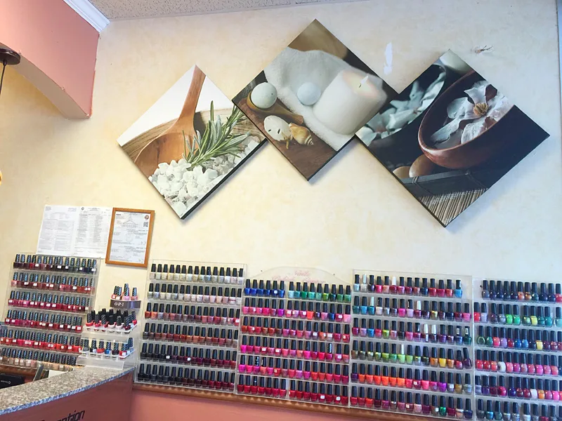 The polish wall at Marco Nail Spa, with rows of colors
